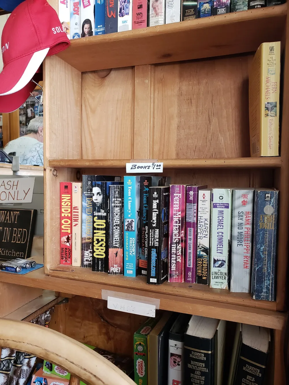 A shelf of paperbacks to borrow